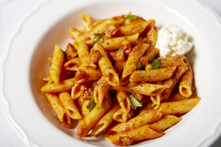 Salty pancetta and fermented pepper paste lend deep  umami to this meaty pasta dish